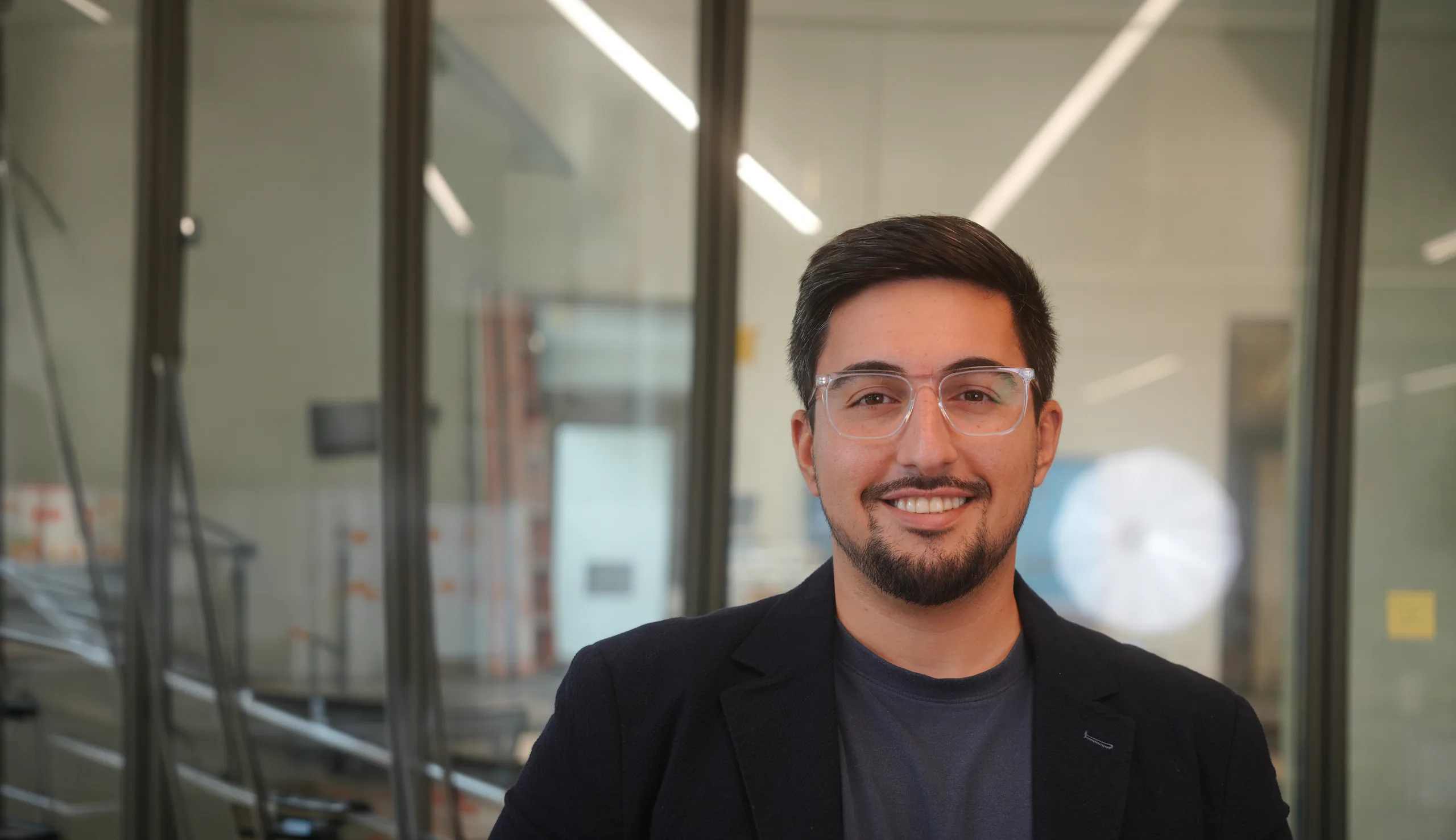 Tristin Esfandiari smiling in a modern office